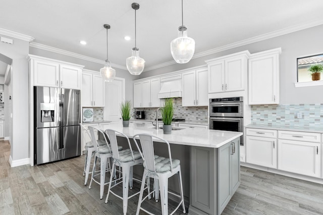 kitchen featuring white cabinetry, sink, and stainless steel appliances