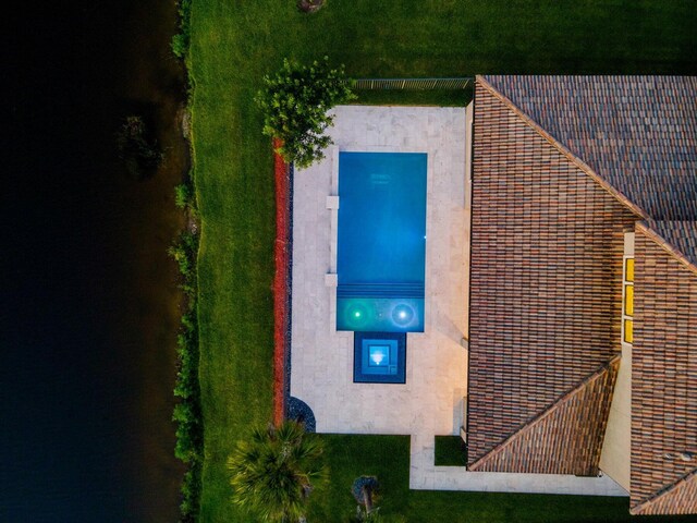 aerial view at dusk with a water view