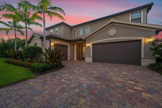 mediterranean / spanish-style home featuring a garage