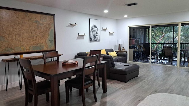 dining area with wood-type flooring