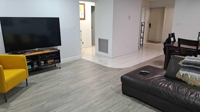 living room with light hardwood / wood-style floors