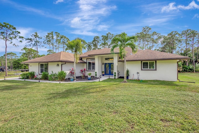 single story home with a front lawn