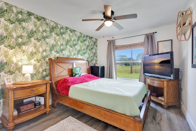 bedroom featuring ceiling fan and dark wood-type flooring