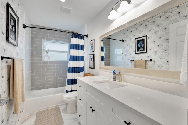 full bathroom with vanity, shower / bath combo, and toilet