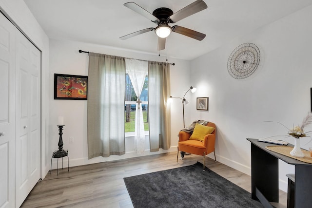 sitting room featuring ceiling fan and light hardwood / wood-style floors