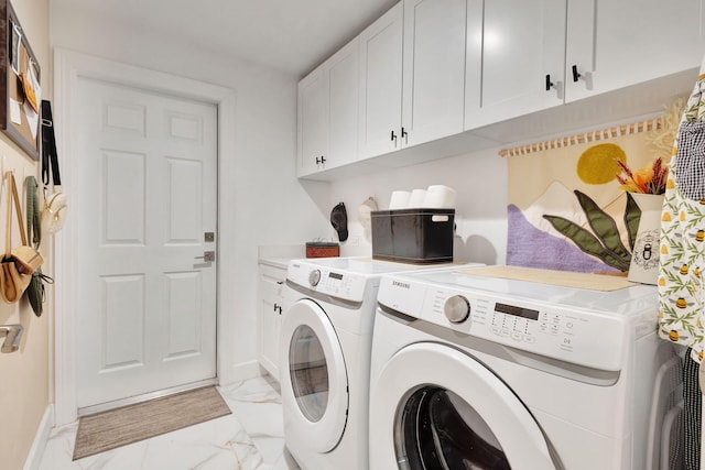 washroom with cabinets and separate washer and dryer