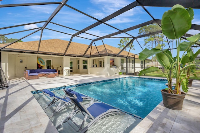 view of swimming pool with an outdoor living space, a patio area, and glass enclosure