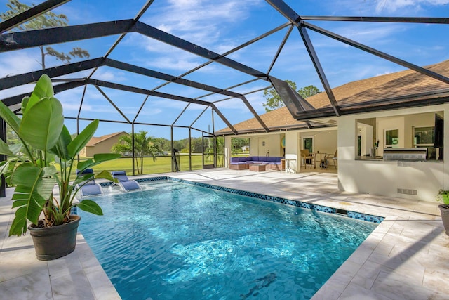 view of swimming pool with a lanai, an outdoor hangout area, pool water feature, a patio area, and a bar