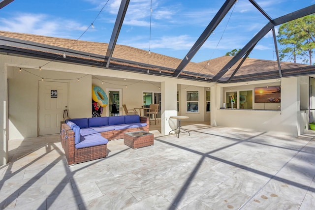 exterior space with a lanai, outdoor lounge area, and a patio