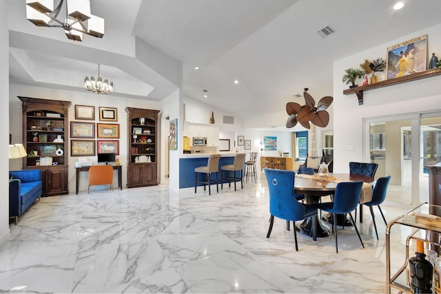 dining room with built in shelves, ceiling fan with notable chandelier, and high vaulted ceiling