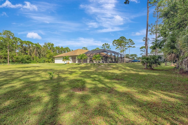 view of yard featuring a lanai