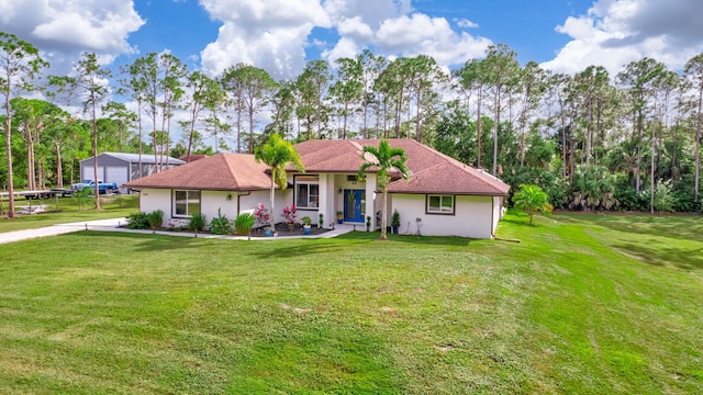 single story home with a front yard