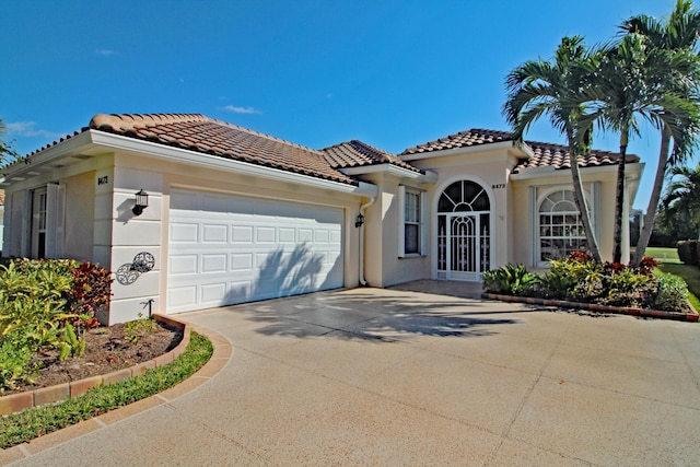 mediterranean / spanish-style house featuring a garage