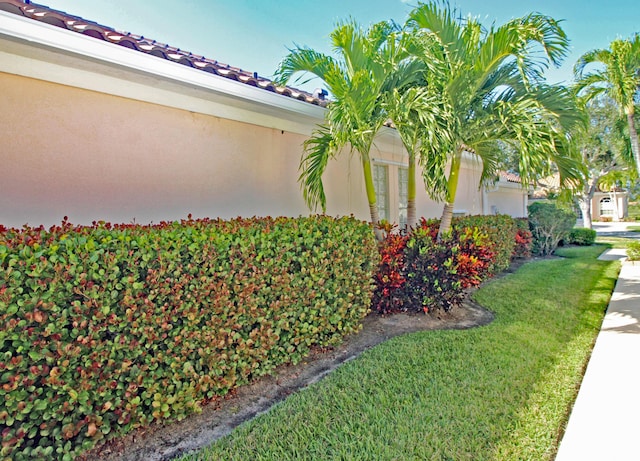 view of home's exterior featuring a lawn