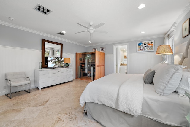 bedroom with ceiling fan, ornamental molding, multiple windows, and ensuite bath