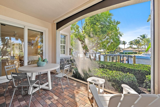 sunroom with a water view