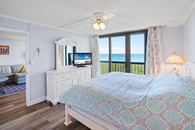 bedroom with access to exterior, a textured ceiling, hardwood / wood-style flooring, and ceiling fan