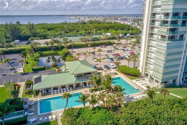 birds eye view of property with a water view