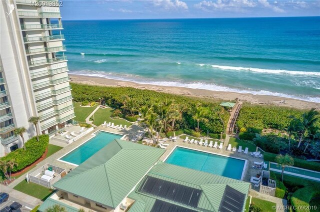 bird's eye view with a beach view and a water view