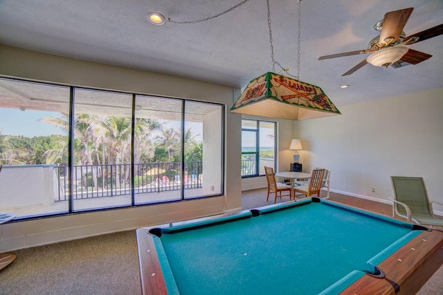 playroom featuring carpet flooring, ceiling fan, a textured ceiling, and pool table