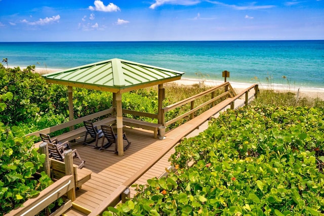 property view of water featuring a beach view