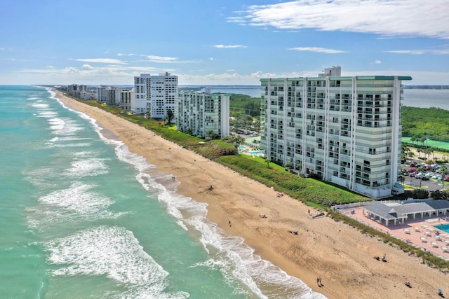 drone / aerial view with a view of the beach and a water view