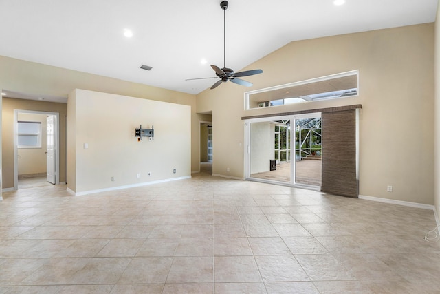 tiled empty room featuring ceiling fan and lofted ceiling