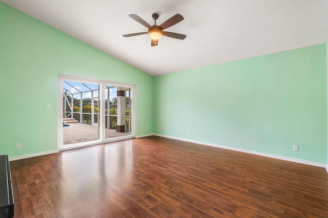 unfurnished room featuring lofted ceiling, dark hardwood / wood-style floors, a textured ceiling, and ceiling fan