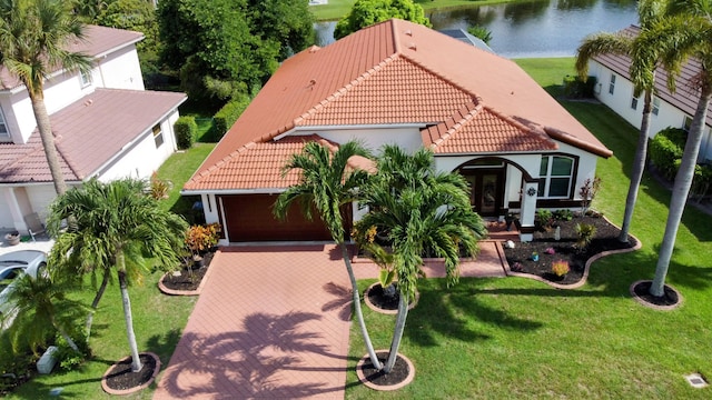 birds eye view of property with a water view