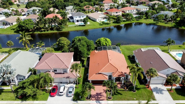 birds eye view of property with a water view