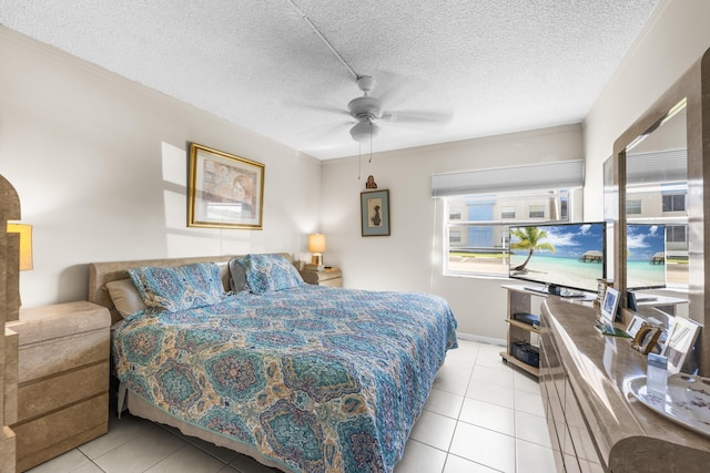 bedroom with a ceiling fan, a textured ceiling, and light tile patterned floors