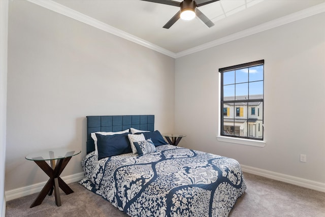 carpeted bedroom with ceiling fan and crown molding