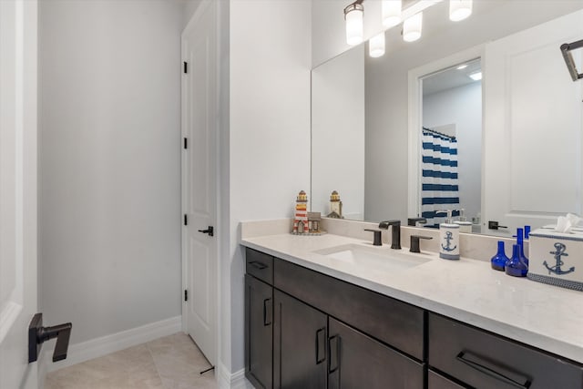 bathroom featuring tile patterned floors and vanity