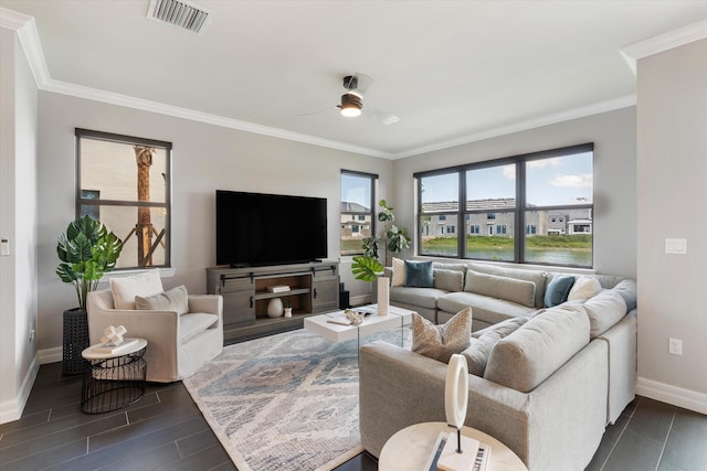 living room featuring ceiling fan and crown molding