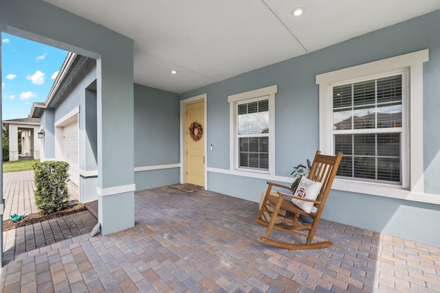 view of patio featuring a garage