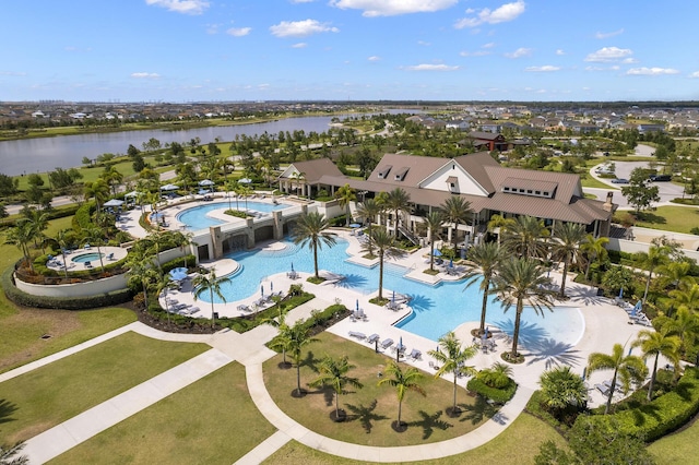 birds eye view of property with a water view