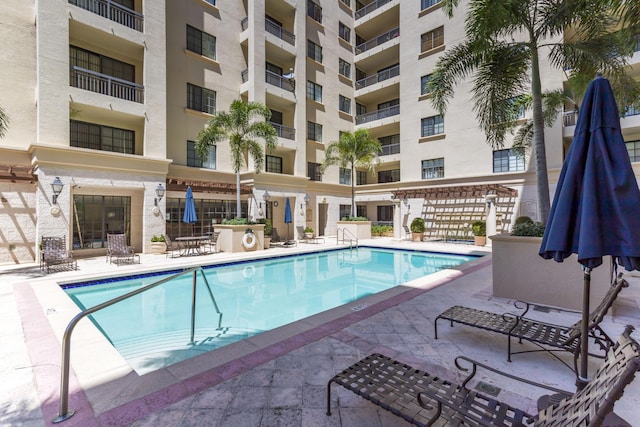 view of swimming pool with a patio area