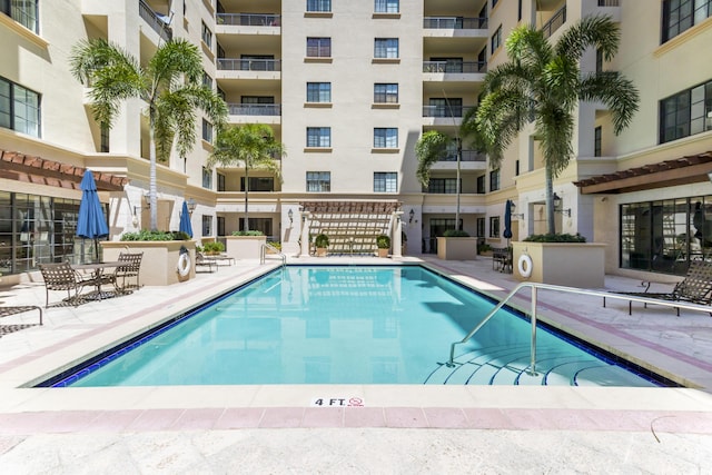 view of swimming pool featuring a patio