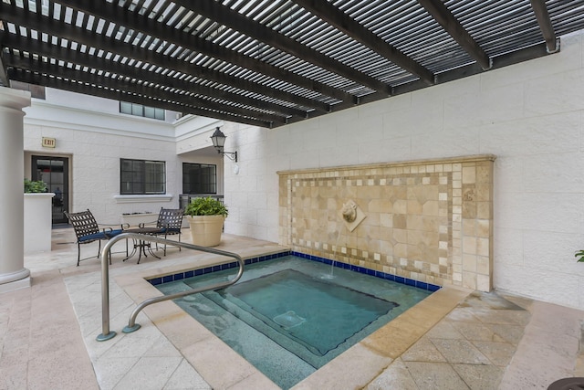 view of pool featuring a patio area and a community hot tub