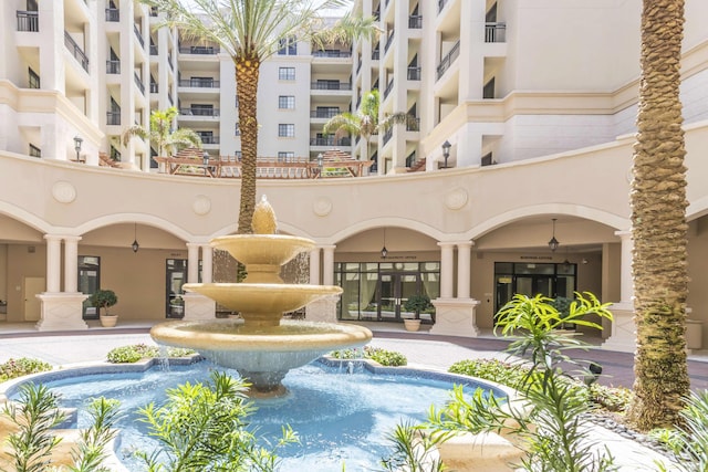 view of swimming pool featuring pool water feature