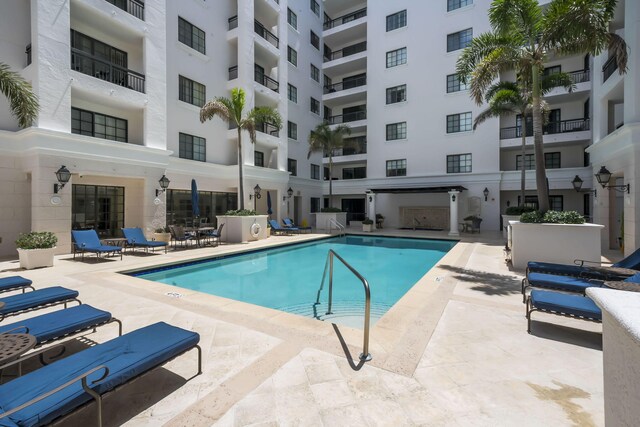 exterior space featuring pool water feature