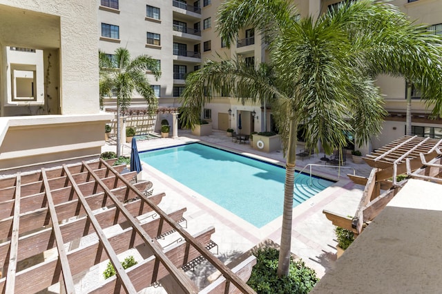 view of swimming pool with a patio area