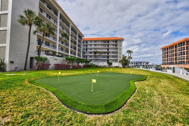 view of property's community with a yard