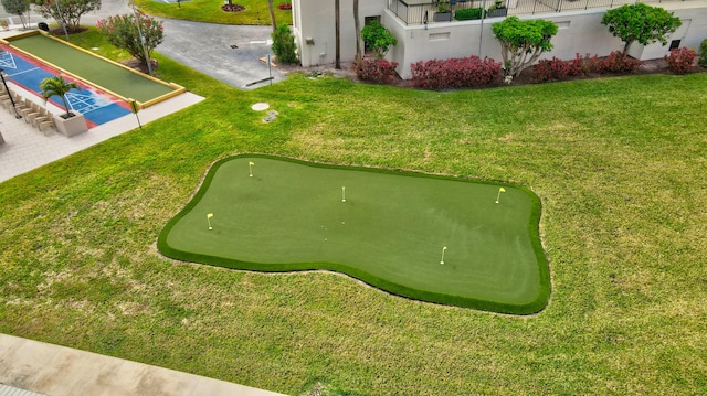 view of property's community with a yard