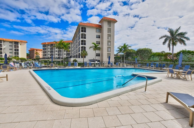 view of swimming pool featuring a patio area