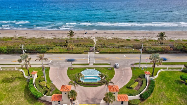 birds eye view of property featuring a view of the beach and a water view