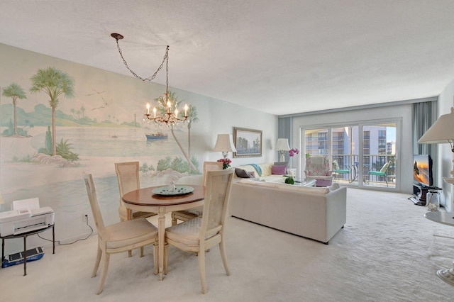 carpeted dining space featuring a chandelier