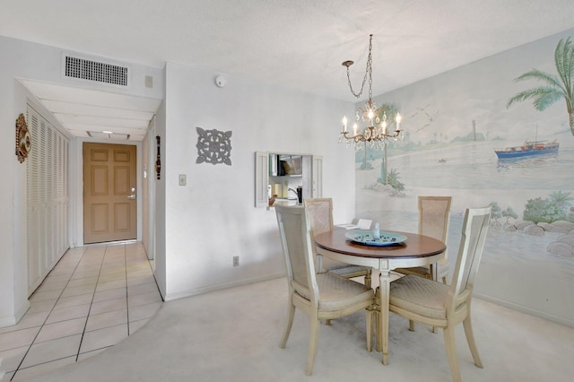 dining space with an inviting chandelier and light tile patterned floors