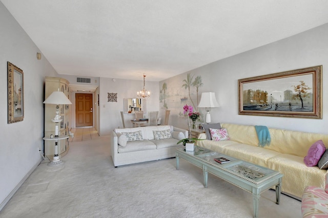 carpeted living room with a chandelier