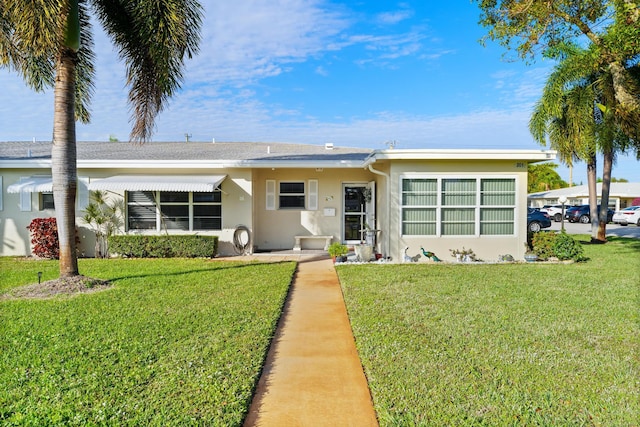 single story home featuring a front yard